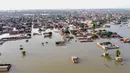 Pemandangan dari udara ini menunjukkan daerah pemukiman yang banjir setelah hujan lebat di provinsi Balochistan (29/8/2022). Jumlah korban tewas akibat banjir monsun di Pakistan sejak Juni telah mencapai 1.136, menurut angka yang dirilis pada 29 Agustus oleh Otoritas Manajemen Bencana Nasional negara itu. (AFP/Fida Hussain)