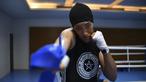 Khadija Mardi, petinju wanita asal Maroko saat melakukan sesi latihan sebelum berlaga pada ajang Olimpiade Rio 2016 di Riocentro complex, Rio de Janeiro, Brasil (1/8/2016). (AFP/Yuri Cortez)