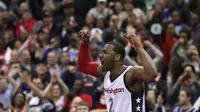 Reaksi John Wall usai melesakkan tembakan penentu kemenangan Wizards (AFP)