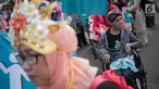 Sejumlah penyandang disabilitas mengikuti pawai budaya di kawasan MH Thamrin, Jakarta, Selasa (27/8/2019). Kegiatan bertema “Menuju Disabilitas Merdeka” tersebut menuntut pemerintah Indonesia untuk tidak melakukan diskriminasi terhadap mereka. (Liputan6.com/Faizal Fanani)
