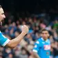 Ekspresi pemain Napoli, Gonzalo Higuain, setelah mencetak gol pertama Napoli ke gawang Empoli pada lanjutan Serie A Italia di Stadion San Paolo, Minggu (31/1/2016) malam WIB. (AFP/Carlo Hermann)