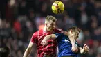 Pemain Bristol City, Ross McCrorie berduel dengan pemain West Ham United, James Ward-Prowse pada laga putaran ketiga Piala FA 2023/2024 di Ashton Gate Stadium, Bristol, Inggris, Rabu (17/01/2024) WIB. (AFP/Adrian Dennis)