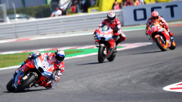 Aksi Pembalap Andrea Dovizioso Juara MotoGP San Marino