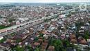 Foto udara menunjukkan pemandangan kota Palembang, Sumatera Selatan, Minggu (12/3/2023). Target ini naik dari capaian kunjungan wisatawan pada 2022, yakni 1,5 juta wisatawana.(Liputan6.com/Herman Zakharia)