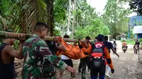 Proses evakuasi jenazah korban longsor di Desa Tulabolo, Kecamatan Suwawa Timur, Kabupaten Bone Bolango. Foto:Mila-Kominfotik (Arfandi Ibrahim/Liputan6.com)