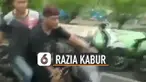 Dua pria pengendara motor kabur saat razia tertib masker yang dilakukan oleh anggota polisi dan satpol pp.