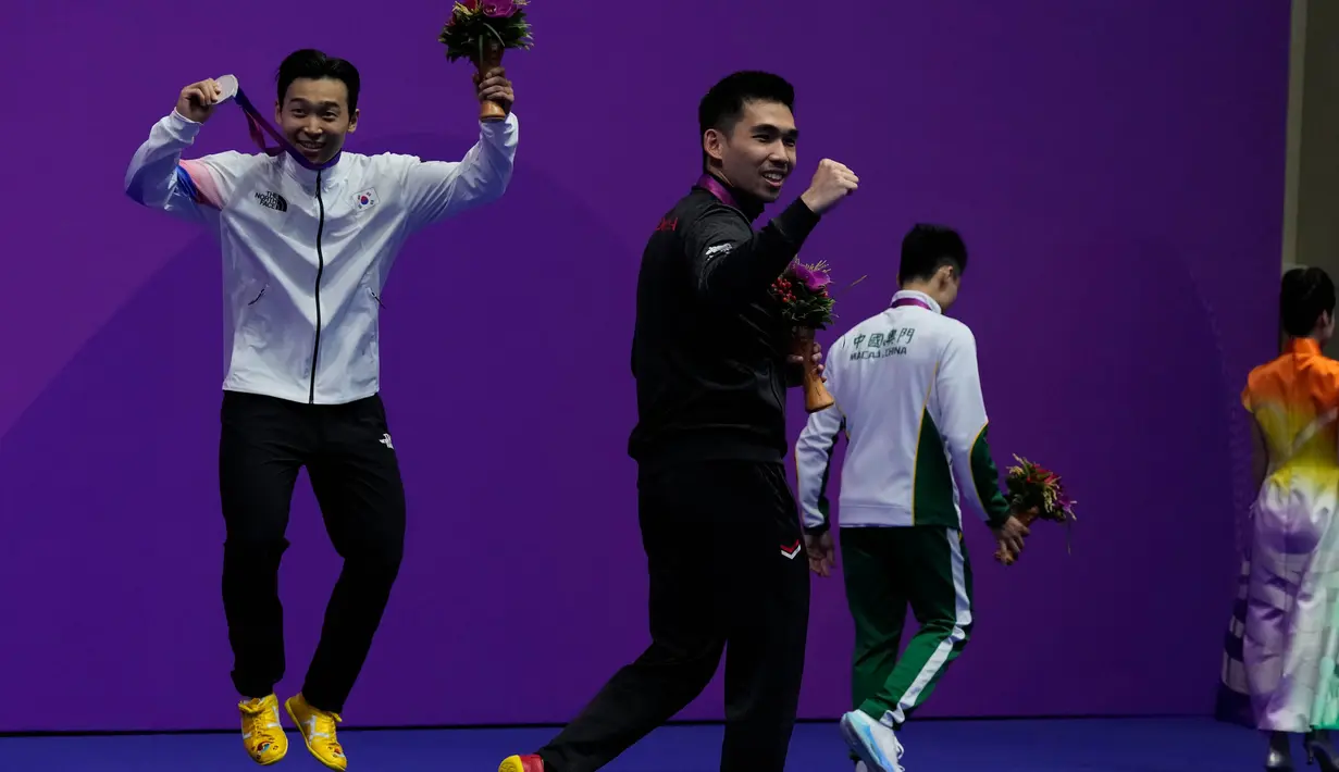Ini menjadi emas ketiga bagi kontingen Indonesia. (AP Photo/Ng Han Guan)