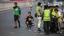 Peserta beristirahat saat mengikuti lomba lari Milo Jakarta International 10K di kawasan Rasuna Epicentrum, Jakarta, Minggu (14/7/2019). Milo Jakarta International 10K terbagi dalam tiga kategori yaitu 5K, 10K, dan Family Run. (Liputan6.com/Faizal Fanani)