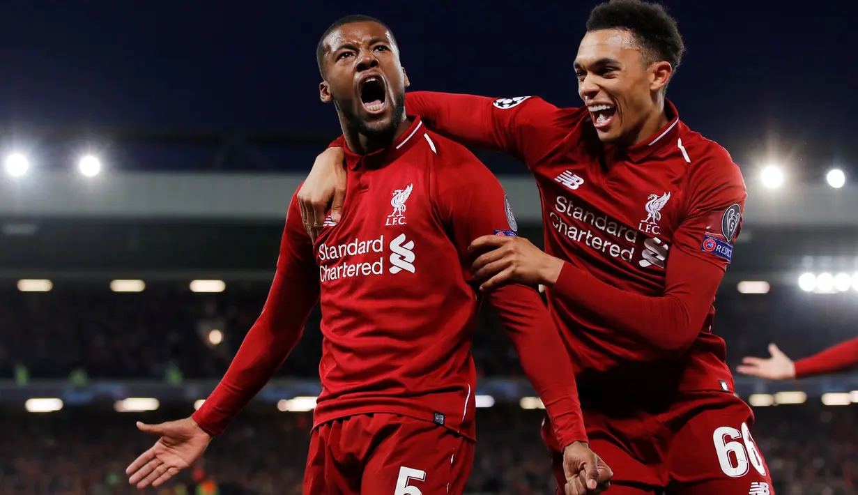 Gelandang Liverpool, Georginio Wijnaldum berselebrasi dengan Trent Alexander-Arnold setelah mencetak gol ke gawang Barcelona pada laga kedua semifinal Liga Champions di Anfield, Selasa (7/5/2019).  Liverpool sukses melaju ke final Liga Champions usai menghajar Barcelona 4-0. (AP/Emilio Morenatti)
