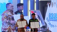 Pemerintah Kota Tarakan melakukan Penandatanganan Nota Kesepakatan (MoU) dan perjanjian kerjasama dengan Badan Perlindungan Pekerja Migran Indonesia (BP2MI) untuk peningkatan kualitas, kompetensi, dan perlindungan bagi Pekerja Migran Indonesia (PMI) di Aula KH Abdurrahman Wahid BP2MI, Jakarta Selatan, Rabu (24/7/2024) (Liputan6.com/Ady Anugrahadi)