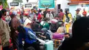 Ribuan orang secara bersamaan mendatangi Terminal Kalideres untuk berangkat menuju berbagai destinasi, di antaranya, Jawa Tengah, Padang, Palembang, Bengkulu dan Lampung. (Liputan6.com/Angga Yuniar)