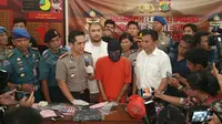 Polisi tangkap pembunuh pensiunan TNI AL. (Liputan6.com/Nanda Perdana Putra)