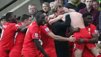 Adam Lallana celebrates with team mates and manager Juergen Klopp after scoring the fifth goal for Liverpool Action Images via Reuters / Alex Morton