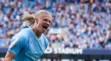 Pemain Manchester City Erling Haaland melakukan selebrasi usai mencetak gol ke gawang Fulham pada pertandingan sepak bola Liga Inggris di Etihad Stadium, Manchester, Inggris, Sabtu (2/9/2023). Manchester City menang 5-1. (AP Photo/Dave Thompson)