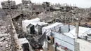 Di tengah gencatan senjata antara Israel dan Hamas, warga Palestina yang mengungsi kembali ke wilayah permukiman di Jabalia, Jalur Gaza Utara. (Bashar TALEB/AFP)