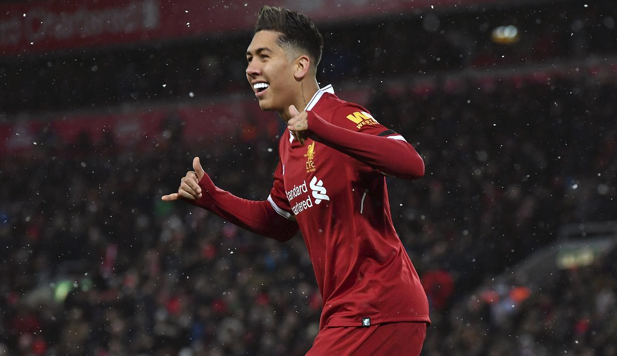 Penyerang Liverpool, Roberto Firmino mengukir namanya pada daftar top scorer sementara Liga Champions dengan koleksi tujuh gol. (Anthony Devlin/PA via AP)