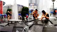 Tak Punya Air, Pasangan Ini Nekat Mandi di Air Mancur Kota