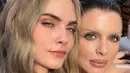 Cara Delevingne juga hadir, super model ini tampil simple mengenakan atasan tank top knit coklat. Rambut pirang panjang bergelombang dibiarkan terurai. [@caradelevingne]