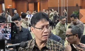 Menteri Keuangan Purbaya Yudhi Sadewa di Kantornya, Jumat (27/3/2026). Purbaya memastikan ekonomi Indonesia masih baik. (Liputan6.com/Gagas)