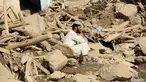 Seorang pria duduk di dekat rumahnya yang rusak setelah banjir besar di provinsi Maidan Wardak di Afghanistan tengah, Minggu, 23 Juli 2023. (AP Photo)