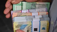 Bank Indonesia juga membuka kuota 5 ribu pendaftar penukaran uang melalui aplikasi PINTAR. (Adek BERRY/AFP)