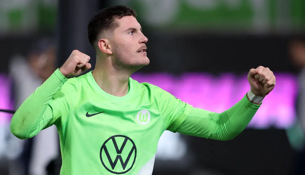 Jonas Wind tampil cemerlang meski klubnya, Wolfsburg memiliki performa yang kurang baik pada musim ini. Wind masuk ke dalam lima pencetak gol terbanyak Bundesliga 2023/2024. Ia sukses melesatkan 9 gol dalam 13 penampilan hingga pekan ke-13 ini. Sementara itu, Wolfburg bertengger di posisi ke-11 dengan raihan 16. (AFP/Ronny Hartmann)