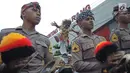 Petugas polisi saat meramaikan Karnaval Seni Budaya Lintas Agama di kawasan Jalan Pemuda  Semarang, Minggu (25/3). Acara ini juga diikuti komunitas budaya lainnya hingga berjumlah 25  atraksi dari berbagai daerah di Jawa Tengah. (Liputan6.com/Gholib)