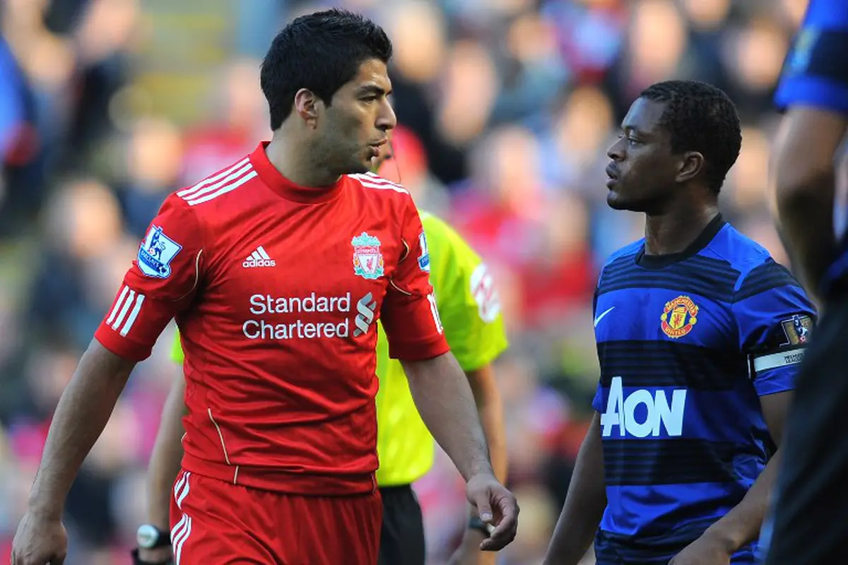 Patrice Evra dan Luis Suarez