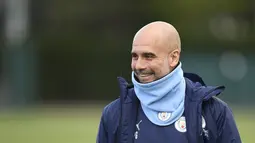Manajer Manchester City asal Spanyol Pep Guardiola bereaksi ketika ia tiba untuk memimpin sesi latihan di tempat latihan Manchester City di Manchester, Inggris barat laut, pada 25 April 2022. Manchester City akan bertanding melawan Real Madrid pada leg pertama semifinal Liga Champions. (AFP/Oli Scarff)