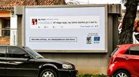 Kelompok aktivis mempermalukan pengguna Facebook dengan menayangkan komentar rasisnya di papan iklan dekat rumah mereka.