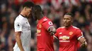 Bek Manchester United, Eric Bailly bersitegang dengan striker Liverpool, Dominic Solanke pada laga Premier League di Stadion Old Trafford, Manchester, Sabtu (10/3/2018). MU menang 2-1 atas Liverpool. (AFP/Oli Scarff)