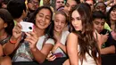 Wanita 28 tahun ini terlihat ramah menyapa para penggemar di acara peluncuran film tersebut, California, (3/8/14). (Kevin Winter/Getty Images for Paramount Pictures/AFP)