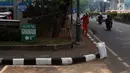 Suasana lalu lintas sekitar Gedung Granadi di Jalan HR Rasuna Said Kuningan, Jakarta, Rabu (21/11). Kejaksaan tengah menelusuri seluruh saham dan rekening atas nama Yayasan Supersemar. (Liputan6.com/JohanTallo)
