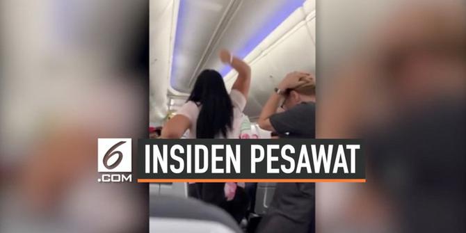 VIDEO: Bertengkar di Pesawat, Istri Pukul Suami Pakai Laptop
