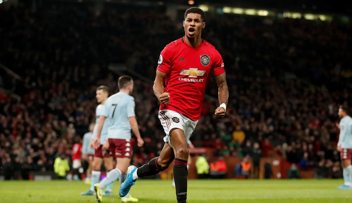 Pemain Manchester United Marcus Rashford berselebrasi usai mencetak gol ke gawang Aston Villa pada pertandingan Liga Inggris di Old Trafford, Manchester, Inggris, Minggu (1/12/2019).  Skor berakhir 2-2. (Martin Rickett/PA via AP)