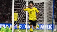 Striker Malaysia, Syafiq Ahmad, merayakan gol yang dicetaknya ke gawang Timnas Indonesia pada laga Kualifikasi Piala Dunia 2022 di SUGBK, Jakarta, Kamis (5/9). Indonesia kalah 2-3 dari Malaysia. (Bola.com/Vitalis Yogi Trisna)