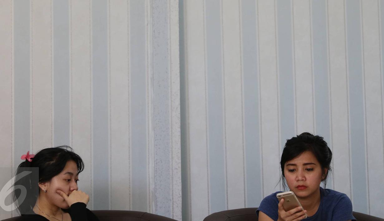 Kedatangan Keluarga Christopher untuk membantu proses identifikasi korban melalui pemeriksaan sampel DNA dan odontologi forensik di RS Polri, Kramat Jati, Jakarta, Senin (2/1). (Liputan6.com/Immanuel Antonius)