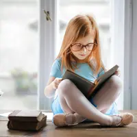 kids reading a book/copyright pexels/Andrea Piacquadio