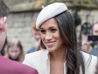 Tunangan Pangeran Harry, Meghan Markle bersama anggota kerajaan Inggris menghadiri acara The Commonwealth Day Service di Westminster Abbey, London, Senin (12/3). Commonwealth Day Service merupakan pertemuan antaragama tahunan Inggris. (AP Photo)