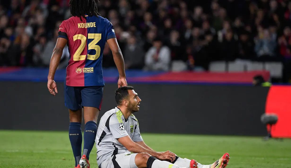 Menjamu Benfica di Estadi Olimpic Lluis Companys, Barcelona sukses mengalahkan Benfica dengan skor 3-1. Kemenangan ini memastikan Barcelona lolos ke perempat final Liga Champions 2024/2025 dengan agregat 4-1 usai menang 1-0 di leg pertama dari Benfica. (Josep LAGO/AFP)