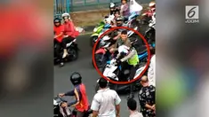 Seorang anggota TNI di kota Pekanbaru yang tidak menggunakan helm ketika berkendara, ditegur oleh anggota Polisi Lantas Polres Pekanbaru