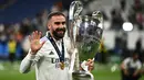 Bek kanan asal Spanyol berusia 32 tahun, Dani Carvajal yang kini tengah menjalani musim ke-12 bersama Real Madrid tercatat telah mengoleksi 26 trofi bareng Los Blancos, termausk 4 trofi La Liga dan 6 trofi Liga Champions. Hingga kini, produk asli akademi Real Madrid yang sempat membela Bayer Leverkusen selama semusim pada 2012/2013 total telah bermain dalam 417 laga di semua kompetisi. (AFP/Anne-Christine Poujoulat)