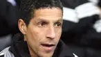 Newcastle United's stand in manager Chris Hughton watches from the bench against West Bromwich Albion during their Premiership football match at The Hawthorns in Birmingham, on February 7, 2009. AFP PHOTO/Chris Ratcliffe