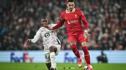 Bermain kandang, Liverpool mendominasi pertandingan sejak menit awal. (Paul ELLIS/AFP)