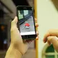 Seorang trainer berhasil menangkap monster ke dalam Pokeball (Liputan6.com/Mochamad Khadafi)