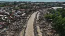 Foto udara menunjukkan rumah-rumah yang rusak akibat terjangan Topan Kalmaegi di Talisay, Provinsi Cebu, Filipina, pada Rabu 5 November 2025. Pada Rabu 5 November 2025, jumlah korban tewas akibat Topan Kalmaegi di Filipina meningkat menjadi 66 orang. (Jam STA ROSA/AFP)