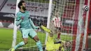 Ekspresi penyerang Liverpool, Mohamed Salah, usai gagal mencetak gol ke gawang Sheffield United pada laga Liga Inggris di Stadion Bramall Lane, Minggu (28/2/2021). Liverpool menang dengan skor 2-0. (Lee Smith, Pool via AP)