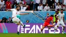 Pemain Iran Rouzbeh Cheshmi menendang bola untuk mencetak gol ke gawang Wales pada pertandingan sepak bola Grup B Piala Dunia 2022 di Stadion Ahmad Bin Ali, Al Rayyan, Qatar, Jumat (25/11/2022). Iran mengalahkan Wales dengan skor 2-0. (AP Photo/Frank Augstein)