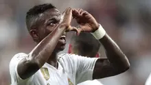 Penyerang Real Madrid, Vinicius Jr berselebrasi usai mencetak gol ke gawang Osasuna pada lanjutan pertandingan La Liga di stadion Santiago Bernabeu, Spanyol (25/9/2019). Real Madrid menang 2-0 atas Osasuna. (AP Photo/Bernat Armangue)