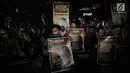 Koalisi Masyarakat Sipil Anti Korupsi bersama Wadah Pegawai melakukan aksi tutup mulut di Gedung KPK, Jakarta, Selasa (12/3). Mereka memperingati peringatan ke-700 hari penyerangan terhadap penyidik senior KPK Novel Baswedan. (merdeka.com/Dwi Narwoko)